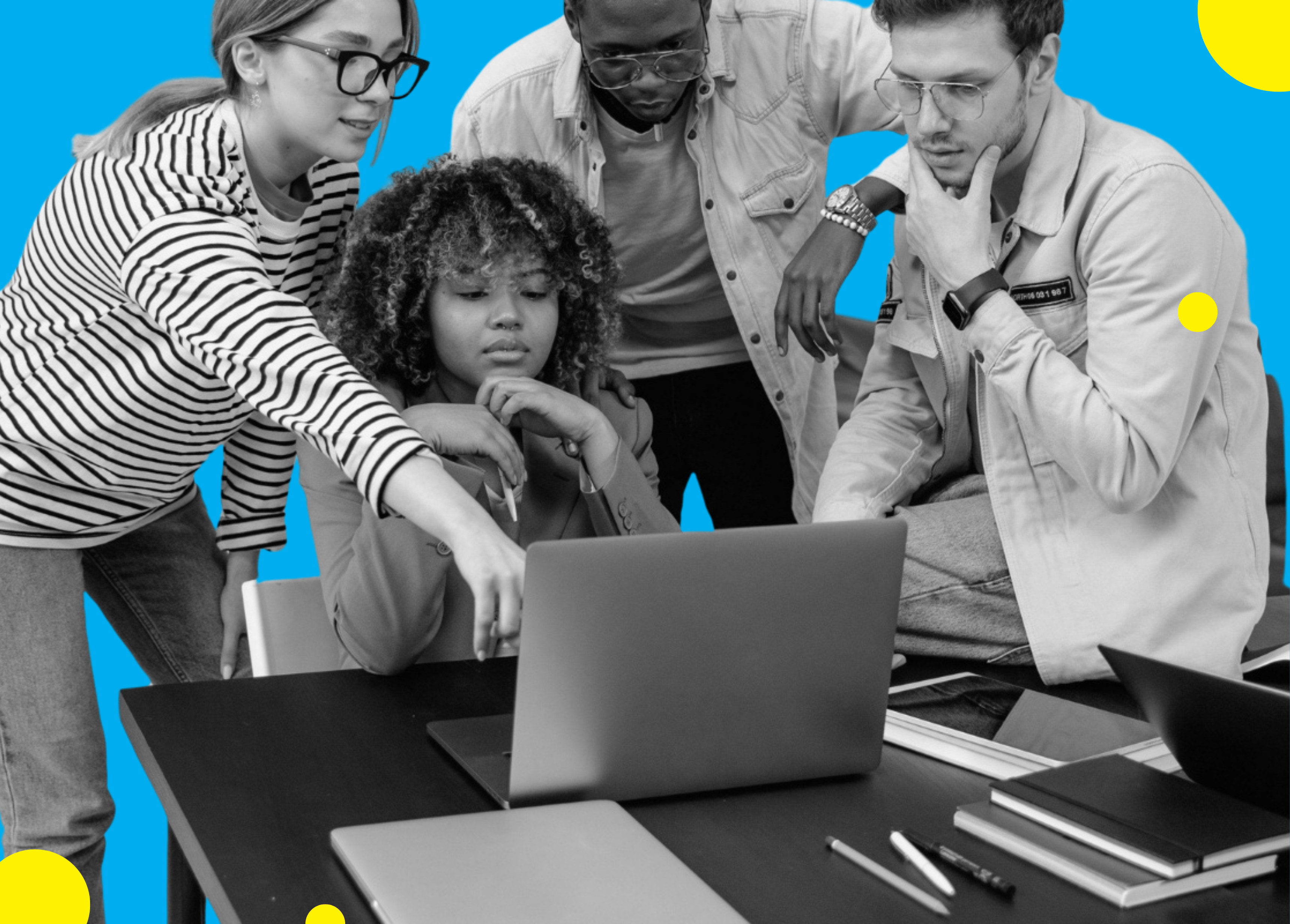 Group of professionals collaborating around a laptop on a desk with colorful accents.