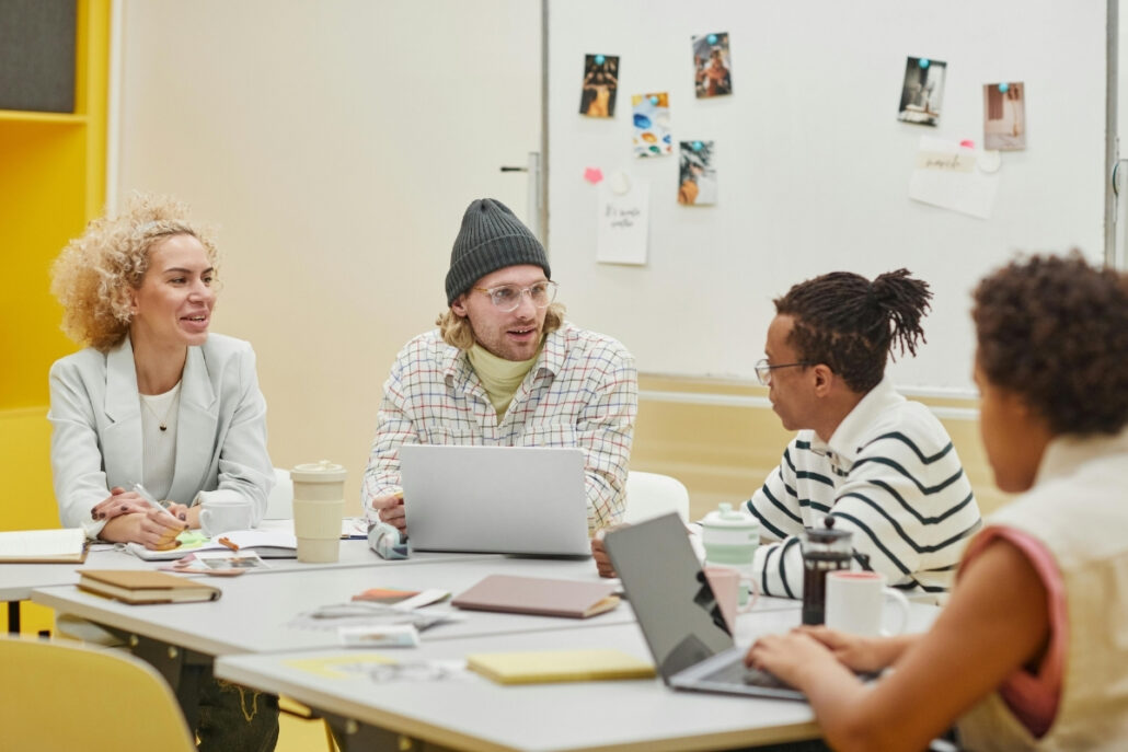 Diverse group of professionals engaged in a collaborative team meeting.