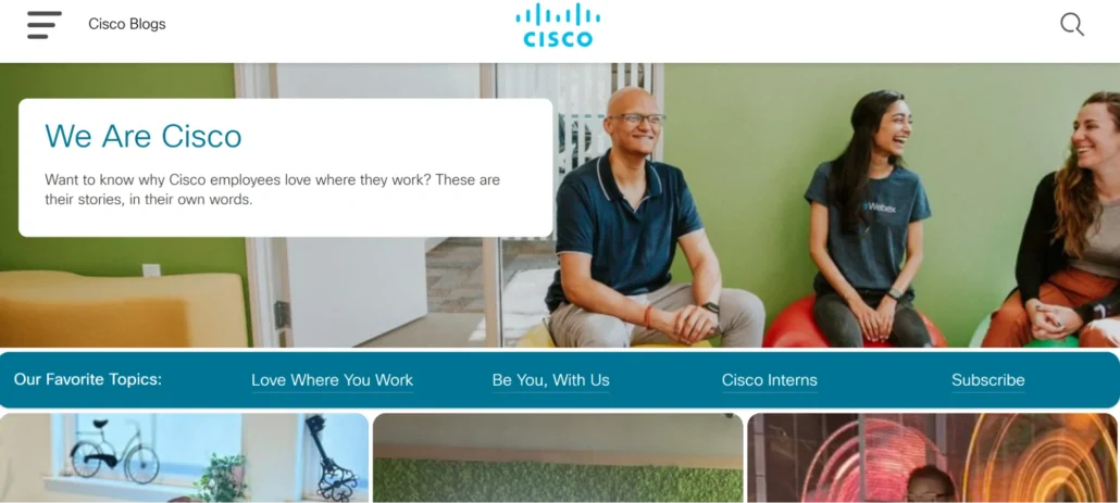 A vibrant office space featuring employees discussing their experiences at Cisco, with a focus on collaboration and company culture.