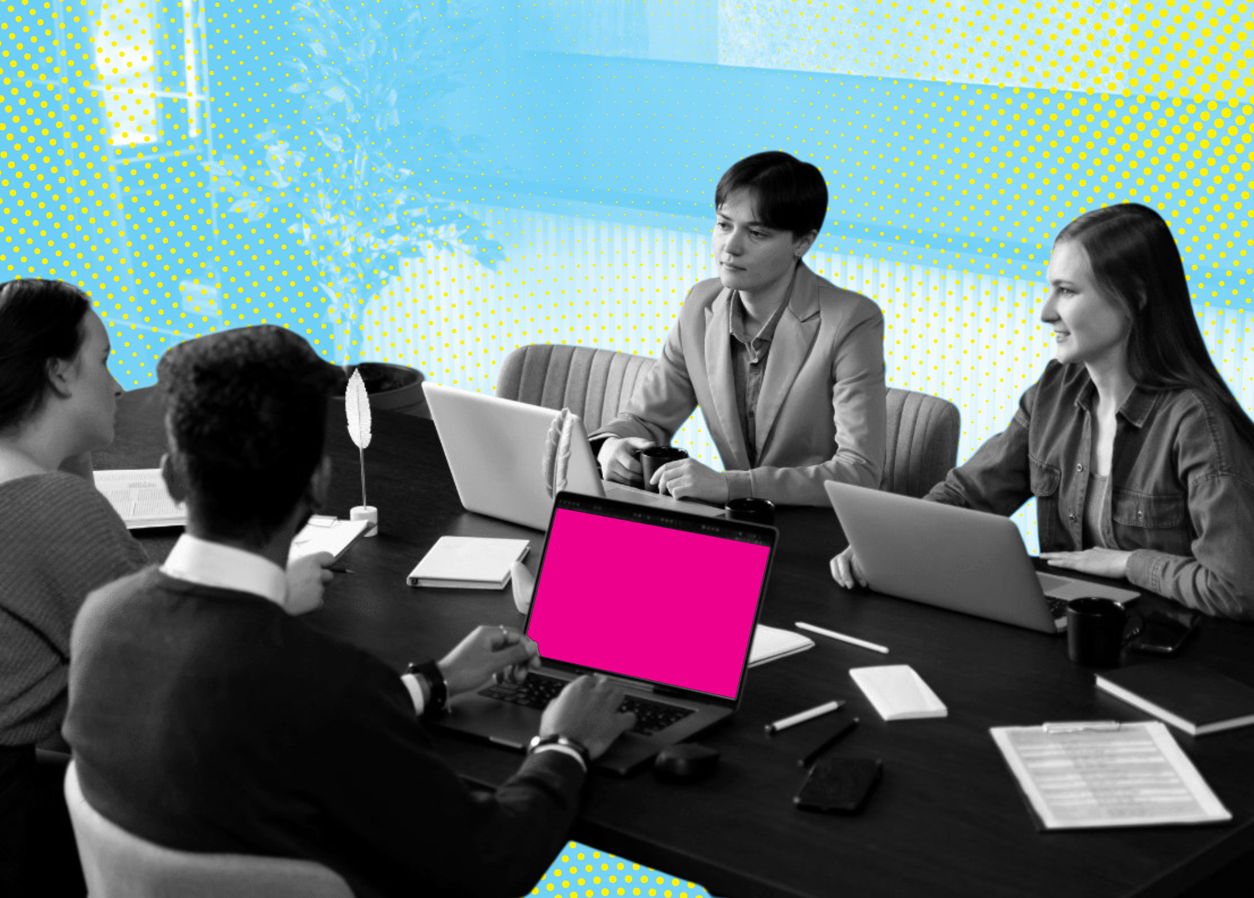 A diverse group of individuals gathered around a conference table, focused on laptops and notes, in a brightly colored workspace.